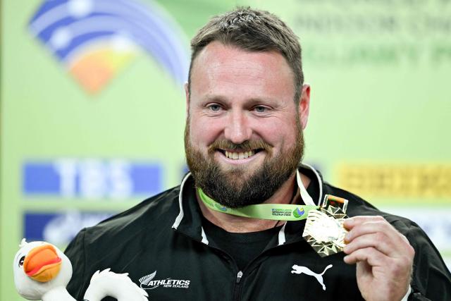 Gold medallist New Zealand's Tom Walsh celebrates on the podium after the men's final shot put event during the World Athletics Indoor Championships Kujawy Pomorze 2026 in Torun, Poland on March 22, 2026. (Photo by Kirill KUDRYAVTSEV / AFP)