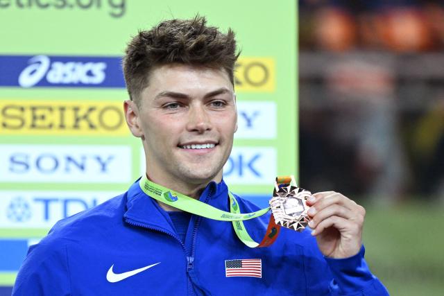 Bronze medallist USA's Trey Cunningham celebrates on the podium for the men's 60m hurdles event during the World Athletics Indoor Championships Kujawy Pomorze 2026 in Torun, Poland on March 22, 2026. (Photo by Kirill KUDRYAVTSEV / AFP)