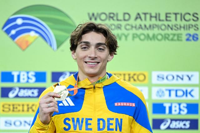 Gold medallist Sweden's Armand Duplantis celebrates on the podium for the men's pole vault event during the World Athletics Indoor Championships Kujawy Pomorze 2026 in Torun, Poland on March 22, 2026. (Photo by Kirill KUDRYAVTSEV / AFP)