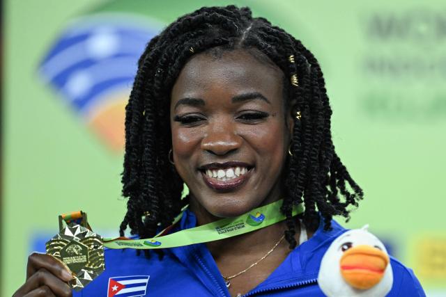 Gold medallist Venezuela's Yulimar Rojas celebrates on the podium for the women's triple jump event during the World Athletics Indoor Championships Kujawy Pomorze 2026 in Torun, Poland on March 22, 2026. (Photo by Kirill KUDRYAVTSEV / AFP)