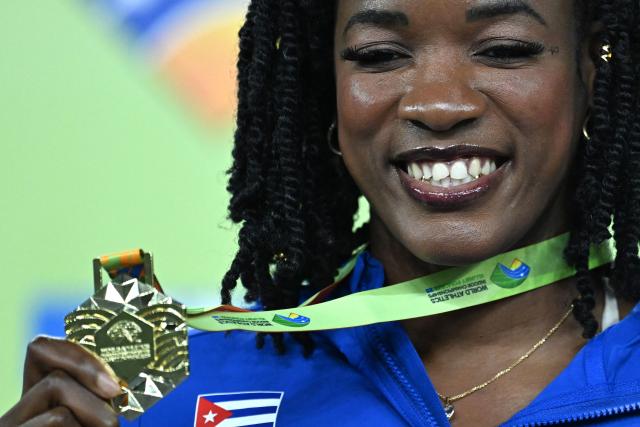 Gold medallist Venezuela's Yulimar Rojas celebrates on the podium for the women's triple jump event during the World Athletics Indoor Championships Kujawy Pomorze 2026 in Torun, Poland on March 22, 2026. (Photo by Kirill KUDRYAVTSEV / AFP)