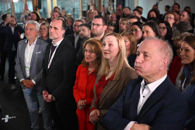 Members of the Social Democratic party (SPD) party react to the first exit polls of the Rhineland-Palatinate's state elections on March 22, 2026 at the regional parliament in Mainz, southwestern Germany. According to forecasts for ARD and ZDF, the Christian Democrats, led by top candidate Gordon Schnieder, achieved 30.5 percent, while the Social Democrats of Minister President Alexander Schweitzer reached between 26.5 and 27.0 percent. In third place came the AfD with 20.0 percent, ahead of the Greens with 7.5 to 8.5 percent. The FDP, with 2.0 to 2.1 percent, and the Free Voters, with 3.5 to 4.0 percent, would drop out of the state parliament in Mainz, while the Left, at 4.5 percent, must fear missing parliamentary representation for the first time. (Photo by DANIEL PETER / AFP)