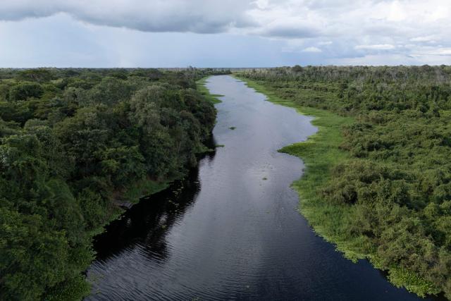 General view of Santo Domingo, a tributary of the Miranda river at the Fazenda San Francisco at the Pantanal, a key region along birds' migratory routes in the Americas, in the municipality of Miranda in Mato Grosso do Sul state, Brazil on March 20, 2026. (Photo by Pablo PORCIUNCULA / AFP)