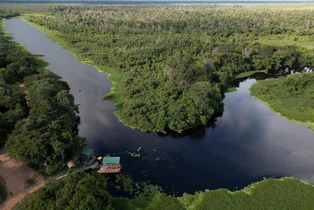 General view of Santo Domingo, a tributary of the Miranda river at the Fazenda San Francisco at the Pantanal, a key region along birds' migratory routes in the Americas, in the municipality of Miranda in Mato Grosso do Sul state, Brazil on March 20, 2026. (Photo by Pablo PORCIUNCULA / AFP)