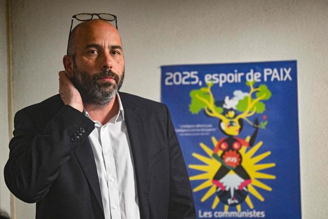 Nimes' City Councillor and left-wing coalition mayoral candidate for Nimes Vincent Bouget reacts in the campaign while awaiting results for the second round of France's 2026 municipal elections in Nimes, southern France on March 22, 2026. (Photo by Gabriel BOUYS / AFP)
