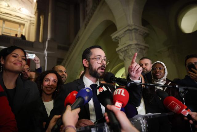 Roubaix' Left-wing La France Insoumise (LFI, Unbowed France) mayoral candidate David Guiraud (C) speaks at the party's rally after winning the second round of France's 2026 municipal elections in Roubaix, northern France on March 22, 2026. (Photo by Francois LO PRESTI / AFP)