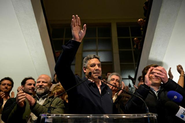 Biarritz' Independant mayoral candidate Serge Blanco (C) waves as he celebrates after winning during a party rally following the results of the second round of France's 2026 municipal elections in Biarritz, southwestern France on March 22, 2026. (Photo by PHILIPPE LOPEZ / AFP)