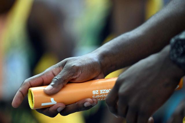 Jamaica's Reheem Hayles holds a baton as he competes in the men's final 4x400 metres relay event during the World Athletics Indoor Championships Kujawy Pomorze 2026 in Torun, Poland on March 22, 2026. (Photo by Kirill KUDRYAVTSEV / AFP)
