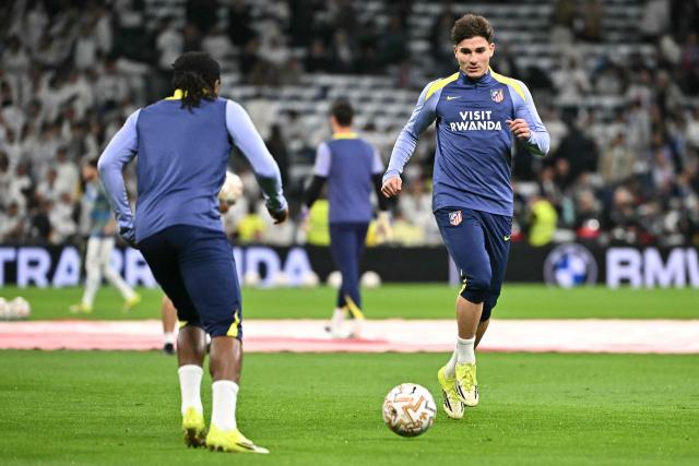 Atletico Madrid's Argentine forward #19 Julian Alvarez warms up before the Spanish league football match between Real Madrid CF and Club Atletico de Madrid at Santiago Bernabeu Stadium in Madrid on March 22, 2026. (Photo by Javier SORIANO / AFP)