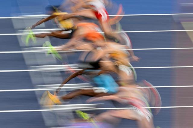 Athletes compete in the women's semi-final 60 metres hurdles event during the World Athletics Indoor Championships Kujawy Pomorze 2026 in Torun, Poland on March 22, 2026. (Photo by Andrej ISAKOVIC / AFP)