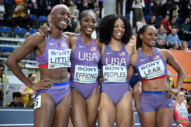 USA's Shamier Little (L), USA's Rosey Effiong, USA's Paris Peoples and USA's Bailey Lear celebrate after the women's final 4x400 metres relay event during the World Athletics Indoor Championships Kujawy Pomorze 2026 in Torun, Poland on March 22, 2026. (Photo by Kirill KUDRYAVTSEV / AFP)