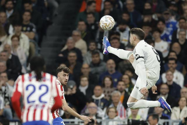 Real Madrid's Uruguayan midfielder #08 Federico Valverde jumps to kick the ball during the Spanish league football match between Real Madrid CF and Club Atletico de Madrid at Santiago Bernabeu Stadium in Madrid on March 22, 2026. (Photo by Oscar DEL POZO / AFP)