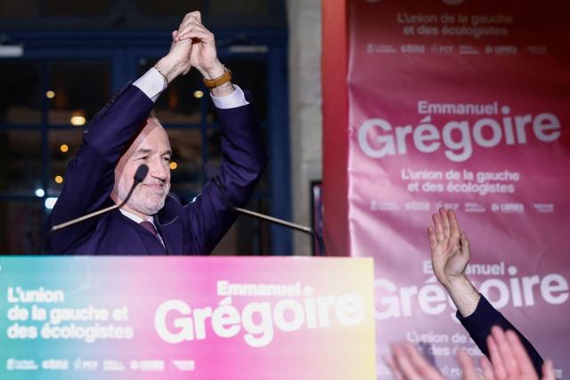 Socialistes et Apparentes' MP and Paris' Mayoral candidate Emmanuel Gregoire celebrates with supporters after his victory following the announcement of official results of the second round of France's 2026 municipal elections, at the Rotonde Stalingrad venue in Paris on March 22, 2026. (Photo by Kenzo TRIBOUILLARD / AFP)