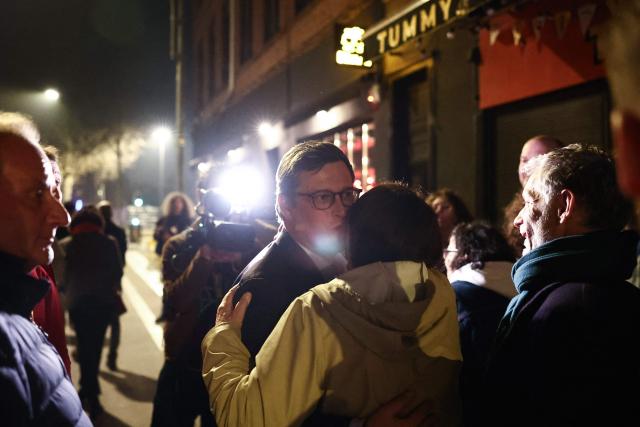 Lille's incumbent mayor and Parti Socialiste (PS) candidate for re-election Arnaud Deslandes celebrates with supporters after winning following the results of the second round of France's 2026 municipal elections in Lille, northern France on March 22, 2026. (Photo by Sameer AL-DOUMY / AFP)