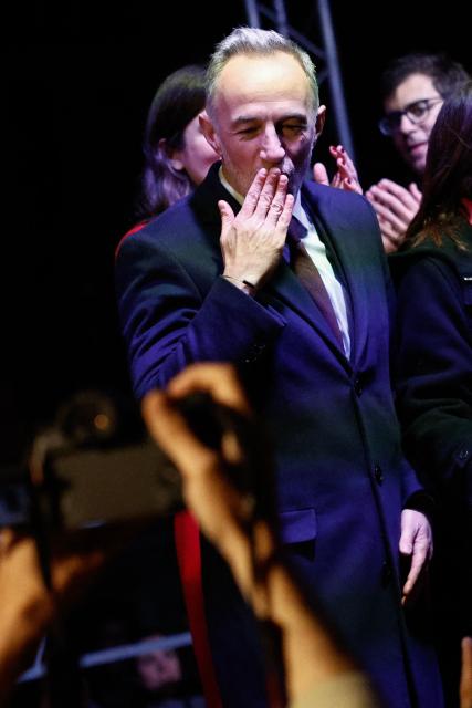 Socialistes et Apparentes' MP and Paris' Mayoral candidate Emmanuel Gregoire sends kisses to supporters after his victory following the announcement of official results of the second round of France's 2026 municipal elections at Paris townhall in Paris on March 22, 2026. (Photo by Kenzo TRIBOUILLARD / AFP)