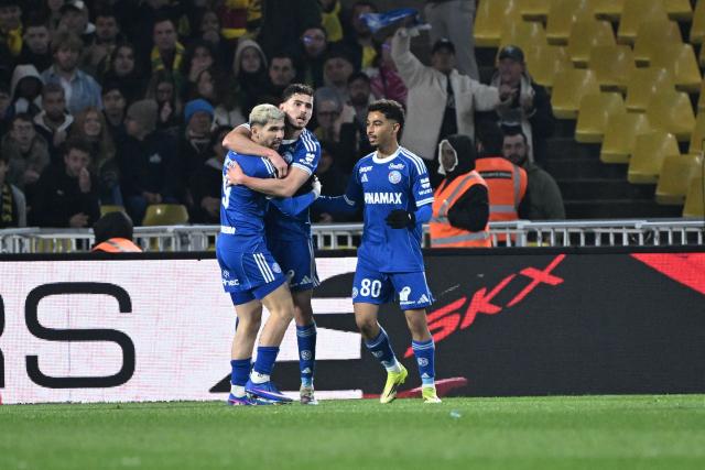 Strasbourg's Argentine forward #09 Joaquin Panichelli celebrates after scoring a goal during the French L1 football match between Nantes and Strasbourg at La Beaujoire stadium in Nantes, western France, on March 22, 2026. (Photo by Sebastien Salom-Gomis / AFP)
