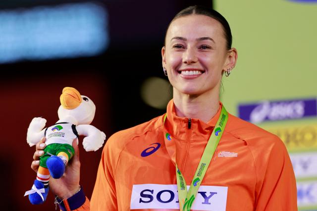 Silver medallist Netherlands' Nadine Visser celebrates on the podium for the women's 60m hurdles event during the World Athletics Indoor Championships Kujawy Pomorze 2026 in Torun, Poland on March 22, 2026. (Photo by Wojtek RADWANSKI / AFP)