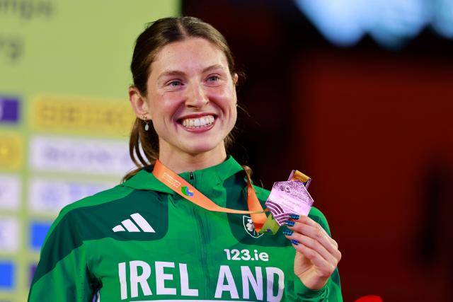 Bronze medallist Ireland's Kate O'Connor celebrates on the podium for the women's pentathlon event during the World Athletics Indoor Championships Kujawy Pomorze 2026 in Torun, Poland on March 22, 2026. (Photo by Wojtek RADWANSKI / AFP)