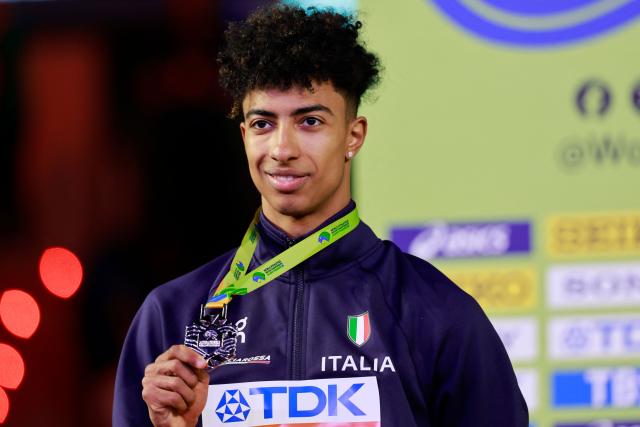 Silver medallist Italy's Mattia Furlani celebrates on the podium for the men's long jump event during the World Athletics Indoor Championships Kujawy Pomorze 2026 in Torun, Poland on March 22, 2026. (Photo by Wojtek RADWANSKI / AFP)