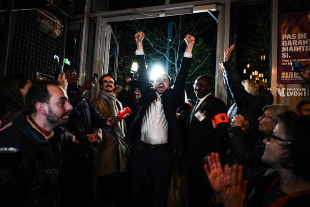 Incumbent mayor of Lyon and Europe-Ecology The Greens (EELV) party candidate for re-election Gregory Doucet celebrates as he arrives to deliver a speech during the party rally after he was re-elected in the second round of France's 2026 municipal elections in Lyon, central eastern France on March 22, 2026. (Photo by JEFF PACHOUD / AFP)