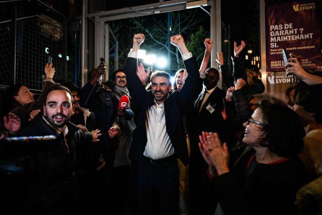 Incumbent mayor of Lyon and Europe-Ecology The Greens (EELV) party candidate for re-election Gregory Doucet celebrates as he arrives to deliver a speech during the party rally after he was re-elected in the second round of France's 2026 municipal elections in Lyon, central eastern France on March 22, 2026. (Photo by JEFF PACHOUD / AFP)