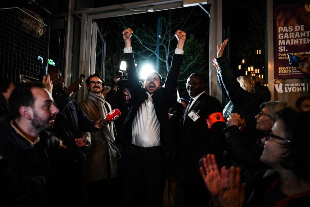 Incumbent mayor of Lyon and Europe-Ecology The Greens (EELV) party candidate for re-election Gregory Doucet celebrates as he arrives to deliver a speech during the party rally after he was re-elected in the second round of France's 2026 municipal elections in Lyon, central eastern France on March 22, 2026. (Photo by JEFF PACHOUD / AFP)