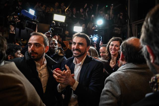 Incumbent mayor of Lyon and Europe-Ecology The Greens (EELV) party candidate for re-election Gregory Doucet celebrates as he arrives to deliver a speech during the party rally after he was re-elected in the second round of France's 2026 municipal elections in Lyon, central eastern France on March 22, 2026. (Photo by JEFF PACHOUD / AFP)