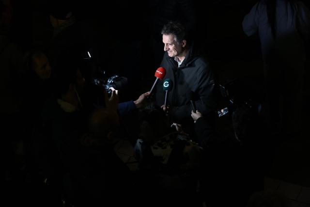Grenoble's outgoing mayor Eric Piolle answers journalists' questions after the victory of Left-wing and ecologist alliance mayoral candidate for Grenoble, Laurence Ruffin (unseen) in the second round of France's 2026 municipal elections in Grenoble, southeastern France on March 22, 2026. (Photo by Maxime Gruss / AFP)