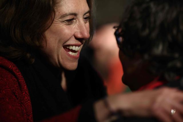 Left-wing and ecologist alliance mayoral candidate for Grenoble, Laurence Ruffin celebrates with a supporter after she won the second round of France's 2026 municipal elections in Grenoble, southeastern France on March 22, 2026. (Photo by Maxime Gruss / AFP)