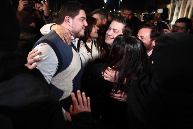 Marseille's incumbent mayor and broad left-wing coalition Printemps Marseillais candidate for re-election Benoit Payan celebrates with French anti-drug activist and electoral candidate Amine Kessaci (L) after winning the second round of France's 2026 municipal elections in Marseille, southern France on March 22, 2026. (Photo by Thibaud MORITZ / AFP)