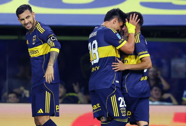 Boca Juniors' midfielder #36 Tomas Aranda (R) celebrates with teammate Paraguayan forward #28 Adam Bareiro next to midfielder #05 Leandro Paredes (L) after scoring his team's first goal during the Argentine Professional Football League 2026 Apertura Tournament match between Boca Juniors and Instituto de Cordoba at La Bombonera Stadium in Buenos Aires on March 22, 2026. (Photo by ALEJANDRO PAGNI / AFP)