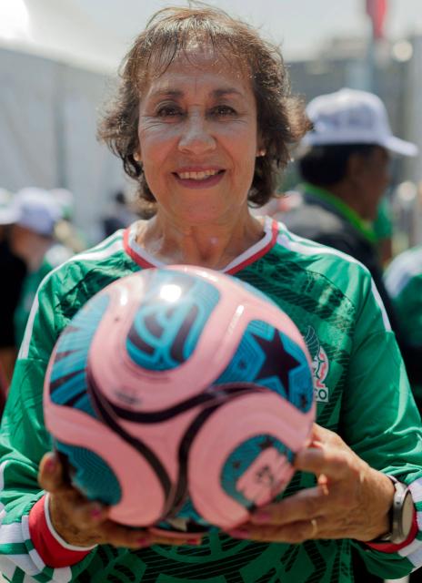 Mexicanb former footballer Alicia "La Pelé" Vargas, 72, considered the third-best CONCACAF player of the 20th century and the top scorer at the 1970 World Cup in Italy, poses for a portrait during an interview with AFP, at the Zocalo square in Mexico City on March 15, 2026. More than half a century ago, a group of young female footballers formed the Mexican women's national team and, despite discrimination and limited support, achieved the third place at the 1970 World Cup and second place the following year. Yet, they remain unrecognised by both the Mexican Football Federation and FIFA, which classified that 1971 tournament as amateur and the women were ultimately banned after demanding to be paid for their work. (Photo by Ivan CASTANEIRA / AFP)