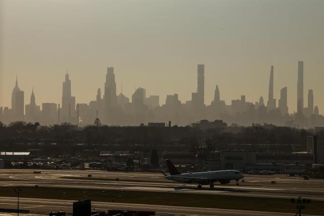 A Delta Airlines Airbus A220-300 passenger plane lands at LaGuardia Airport in New York, on March 22, 2026. (Photo by CHARLY TRIBALLEAU / AFP)