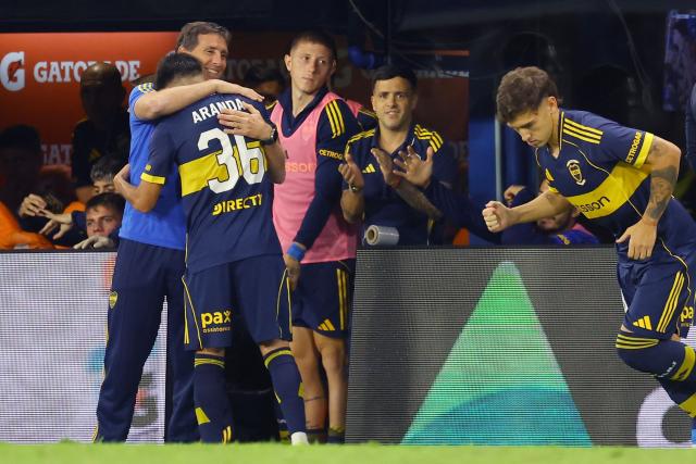 Boca Juniors' head coach Claudio Ubeda embraces Boca Juniors' midfielder #36 Tomas Aranda after his substitution during the Argentine Professional Football League 2026 Apertura Tournament match between Boca Juniors and Instituto de Cordoba at La Bombonera Stadium in Buenos Aires on March 22, 2026. (Photo by ALEJANDRO PAGNI / AFP)