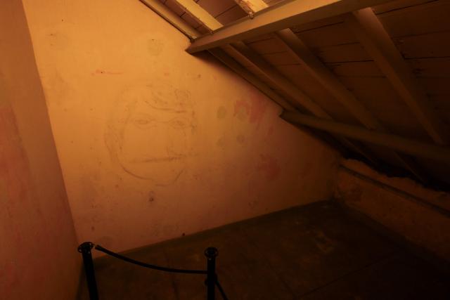 A view of a drawing found on one of the walls in the Officers Casino building at the former clandestine detention center of the Navy School (ESMA) during the Argentine dictatorship (1976-1983), in Buenos Aires on March 18, 2026. Survivors of Argentina's 1976–1983 dictatorship are representatives of a decimated generation whose stories of torture, death and exile come back to life for AFP 50 years after the coup. (Photo by Luis ROBAYO / AFP)