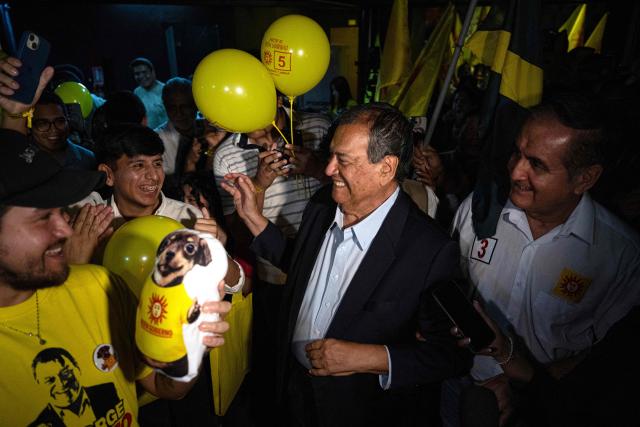 Peru's presidential candidate Jorge Nieto for the Buen Gobierno party, greets supporters as he arrives for a campaign event in Lima on March 22, 2026. Peru will hold presidential elections on April 12. (Photo by ERNESTO BENAVIDES / AFP)