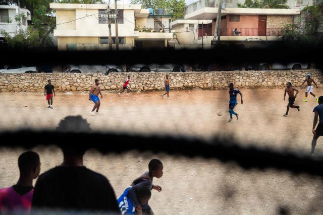 People play football in Delmas, Port-au-Prince, Haiti, on March 22, 2026. (Photo by Clarens SIFFROY / AFP)
