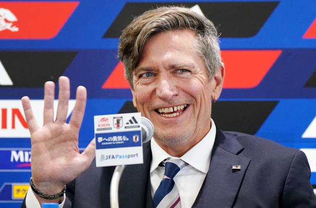 Japan women's national football team head coach Nils Nielsen gestures in response to reporters' applause at the beginning of the press conference following Japan's victory in the AFC Women’s Asian Cup Australia 2026 football tournament, in Tokyo on March 23, 2026. (Photo by Kazuhiro NOGI / AFP)