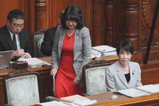 Japan's Prime Minister Sanae Takaichi (front R) and Finance Minister Satsuki Katayama (front L) attend a plenary session of the House of Councillors at Parliament in Tokyo on March 23, 2026. (Photo by Kazuhiro NOGI / AFP)