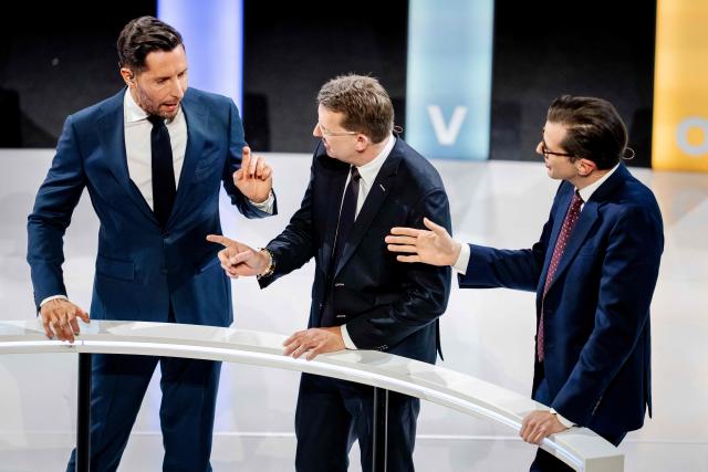 (LtoR) Venstre leader and prime ministerial candidate Troels Lund Poulsen, far-right Dansk Folkeparti (DF) leader Morten Messerschmidt and right-wing Liberal Alliance (LA) leader Alex Vanopslagh take part in a party leaders' debate during Democracy's Evening on DR1 at the Concert Hall in Copenhagen on March 22, 2026. (Photo by Mads Claus Rasmussen / Ritzau Scanpix / AFP) / Denmark OUT