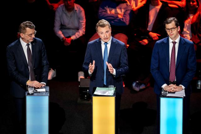 (LtoR) Venstre leader and prime ministerial candidate Troels Lund Poulsen, far-right Dansk Folkeparti (DF) leader Morten Messerschmidt and right-wing Liberal Alliance (LA) leader Alex Vanopslagh take part in a party leaders' debate during Democracy's Evening on DR1 at the Concert Hall in Copenhagen on March 22, 2026. (Photo by Mads Claus Rasmussen / Ritzau Scanpix / AFP) / Denmark OUT
