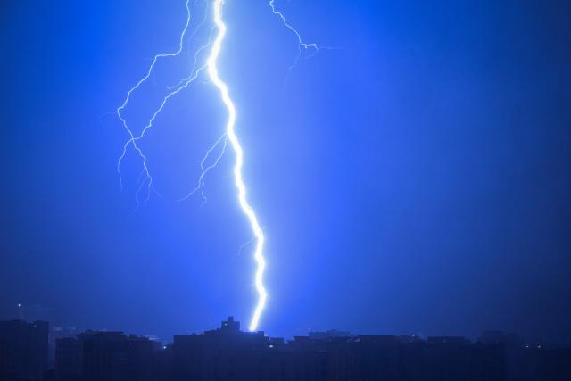 Lightning forks across the sky during a thunderstorm over Doha on March 23, 2026. (Photo by Mahmud Hams / AFP)