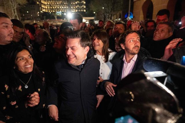 Marseille's incumbent mayor and broad left-wing coalition Printemps Marseillais candidate for re-election Benoit Payan celebrates with supporters after winning the second round of France's 2026 municipal elections in Marseille, southern France on March 22, 2026. (Photo by Elodie CLEMENT / AFP)