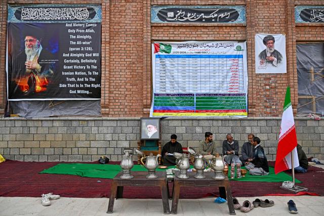 Kashmiri Muslims conduct a donation drive for war-stricken Iran, collecting cash, gold, and other contributions amid the Middle East conflict, on the outskirts of Srinagar on March 23, 2026. (Photo by Tauseef MUSTAFA / AFP)