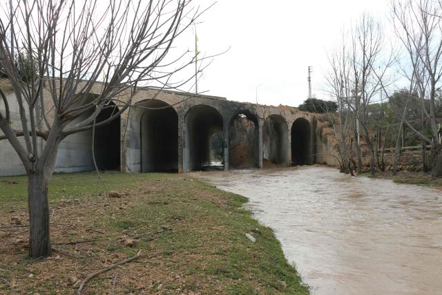 A photograph taken on March 23, 2026 shows the Litani River and the aftermath of the Israeli airstrike that targeted the Qasmiyeh bridge, located on a main highway linking villages in the Tyre district with others further north, after Israel said the bridge was being used by Hezbollah, in southern Lebanon. The Lebanese president on March 22, 2026, slammed Israeli strikes on bridges and other infrastructure in the country's south, calling such attacks a "prelude to a ground invasion". Lebanon was drawn into the Middle East war on March 2, when pro-Iran Hezbollah launched rockets towards Israel in response to US-Israeli strikes that killed Iranian supreme leader on February 28, 2026. (Photo by Kawnat HAJU / AFP) / 