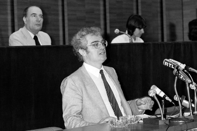(FILES) French national secretary of the Socialist party (PS) Lionel Jospin speaks as french first secretary of the PS Francois Mitterrand (background) looks on during the Socialist party national convention, on June 24, 1979, in Paris. Former socialist Prime Minister Lionel Jospin has died at the age of 88, his family announced on March 23, 2026. (Photo by GEORGES BENDRIHEM / AFP)
