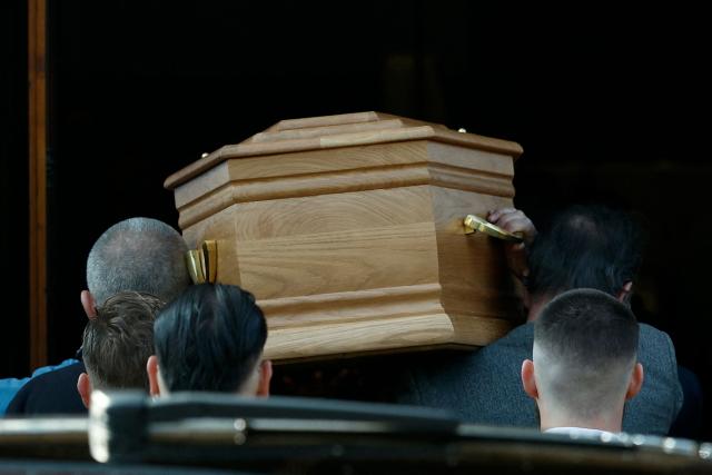 Mourners carry the coffin of late French actor and comedian Bruno Salomone during his funeral at the Sainte-Anne de Polangis church in Joinville-le-Pont on March 23, 2026. Bruno Salomone died on March 15, 2026, aged 55. (Photo by Kenzo TRIBOUILLARD / AFP) / ALTERNATIVE CROP