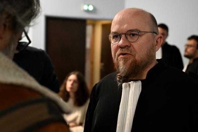 Lawyer Francois Zind, representing environmental associations France Nature Environnement, Lorraine Nature Environnement, Vosges Nature Environnement and Robins des Bois is pictured ahead of the opening hearing of the Nestle Waters trial over the maintenance of four illegal waste dumps in the Vosges department at the judicial complex in Nancy on March 23, 2026. (Photo by Jean-Christophe VERHAEGEN / AFP)