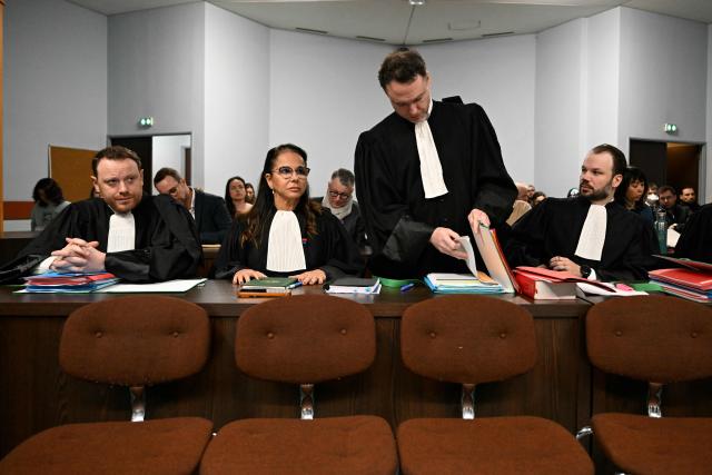 (LtoR) Maël Bertho, Michele Anahory, Christophe Michaud and Flavian Ruda, lawyers for Nestle Waters, get ready for the opening hearing of the Nestle Waters trial over the maintenance of four illegal waste dumps in the Vosges department at the judicial complex in Nancy on March 23, 2026. (Photo by Jean-Christophe VERHAEGEN / AFP)