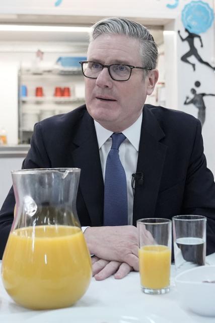 Britain's Prime Minister Keir Starmer pays a visit to St Paul's Church of England Primary School in southeast London on March 23, 2026, to announce further cost-of-living support for parents through an expansion of the government's school-based nurseries. (Photo by Stefan Rousseau / POOL / AFP)